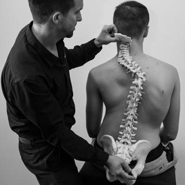 Chiropractor assessing scoliosis at Vitality Chiropractic Perth